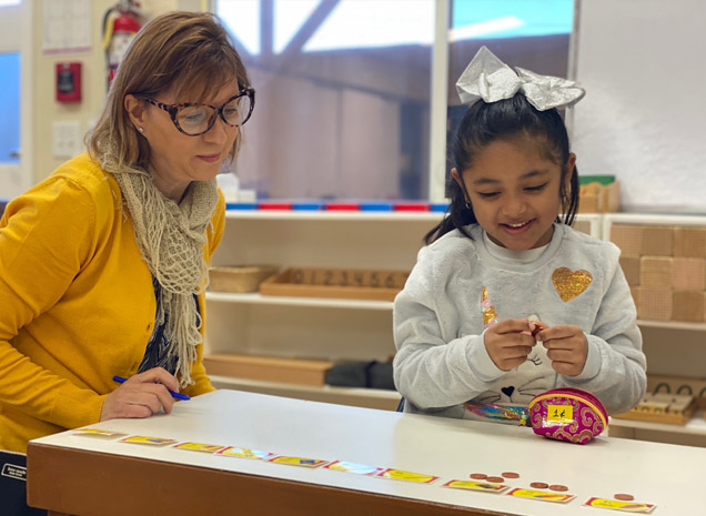 Montessori School of Modesto teacher working with daycare child