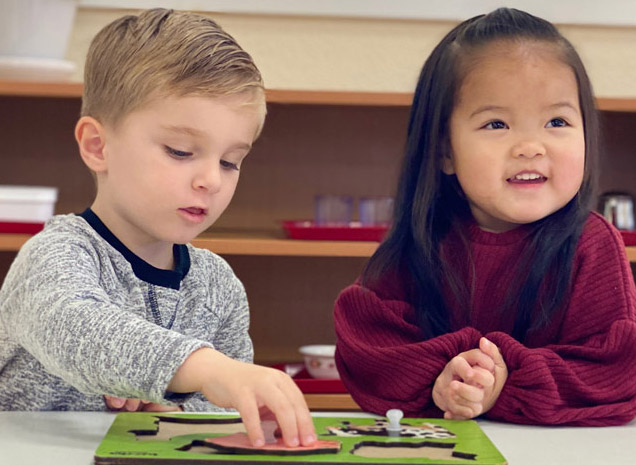 Montessori School of Modesto teacher working with two-year old toddler program