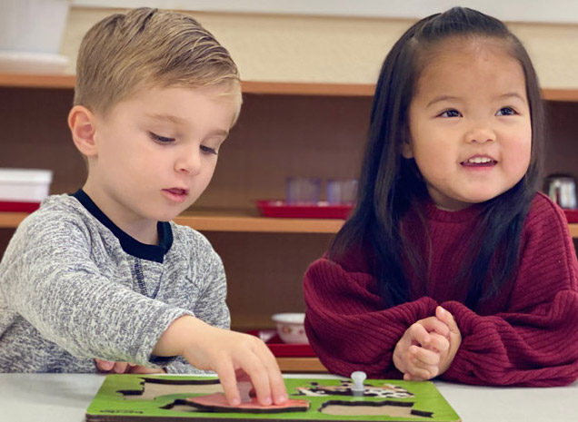 Montessori School of Modesto teacher working with two year old toddler program